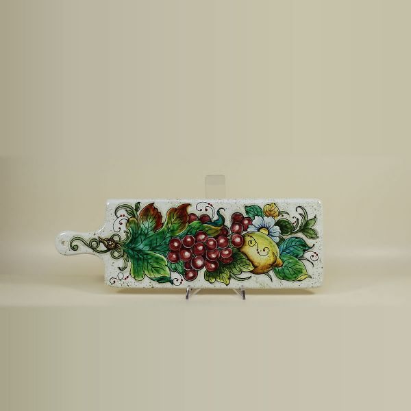 CHOPPING BOARD IN CERAMIC WITH WHITE BACKGROUND, RED GRAPE AND LEMONS