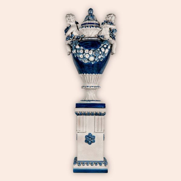 LARGE VASE WITH CHERUBS AND FESTOONS ON A PEDESTAL, cm.180h